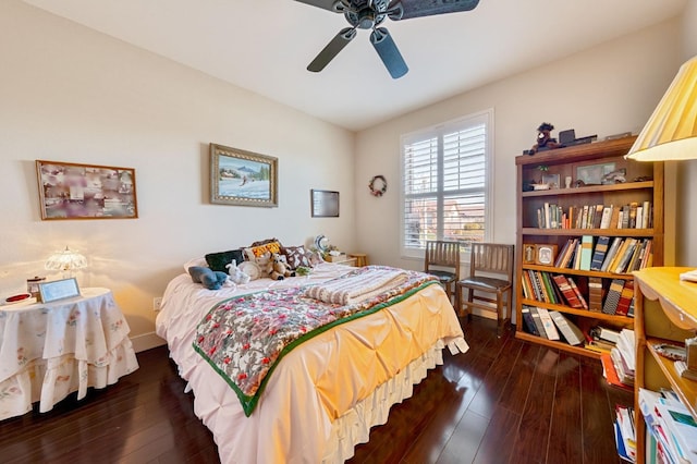 bedroom with hardwood / wood-style floors and a ceiling fan