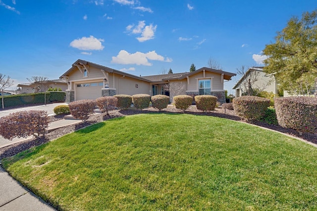 ranch-style home with a front yard, an attached garage, stone siding, and driveway