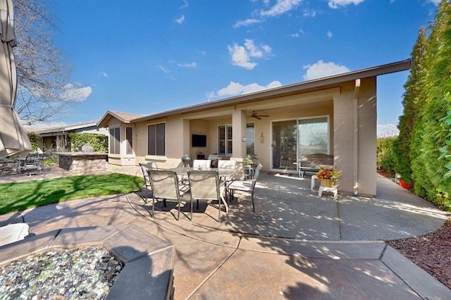 view of patio / terrace with ceiling fan and outdoor dining space