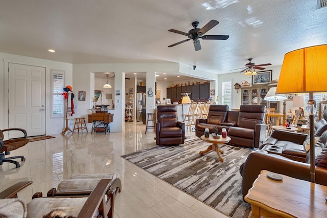 living area featuring a textured ceiling