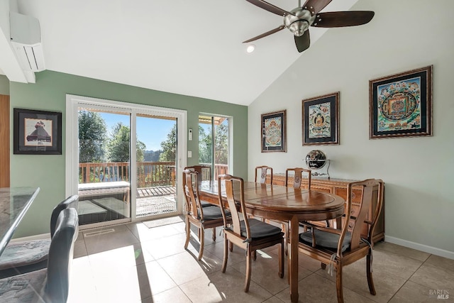 dining room featuring lofted ceiling, ceiling fan, light tile patterned floors, a wall unit AC, and baseboards