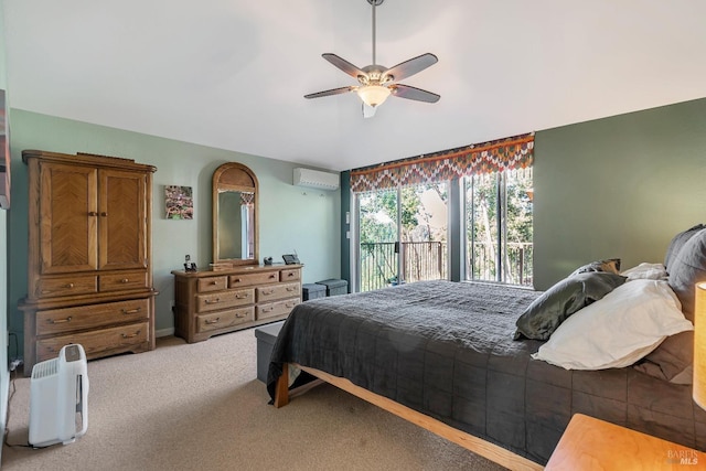 bedroom with ceiling fan, access to outside, a wall mounted air conditioner, and carpet flooring