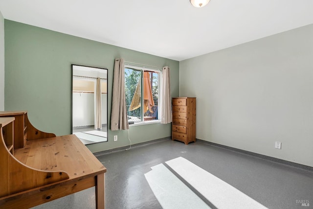 bedroom featuring baseboards