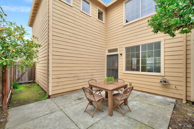 view of patio with fence and outdoor dining area