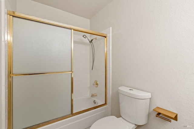 full bath with shower / bath combination with glass door and toilet