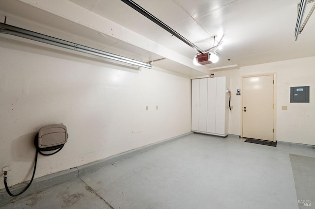 garage featuring electric panel and a garage door opener