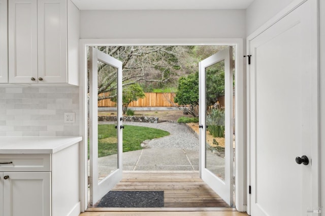 doorway to outside with light wood-type flooring