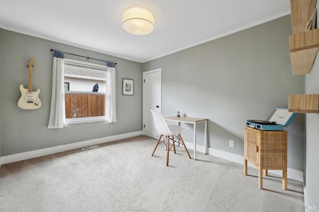 home office with crown molding, carpet floors, visible vents, and baseboards