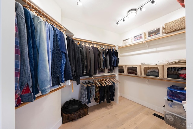 spacious closet with wood finished floors and visible vents