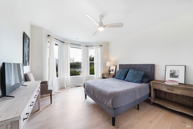 bedroom with light wood-style floors and ceiling fan