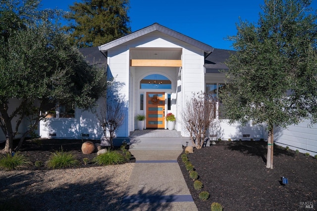 doorway to property featuring crawl space