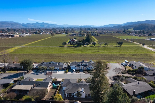 drone / aerial view with a mountain view, a residential view, and a rural view