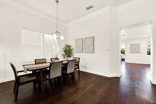 dining space with ornamental molding, visible vents, dark wood finished floors, and baseboards