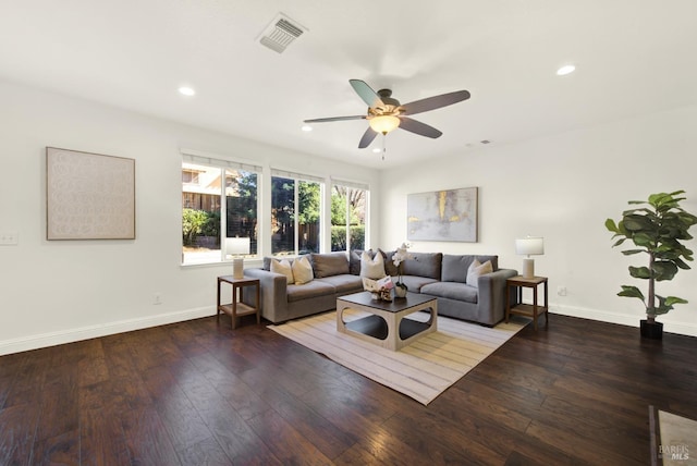 living area with recessed lighting, wood finished floors, visible vents, and baseboards