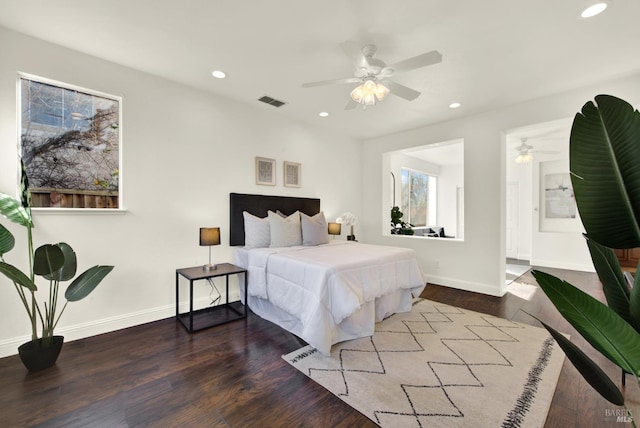 bedroom with recessed lighting, visible vents, ceiling fan, wood finished floors, and baseboards