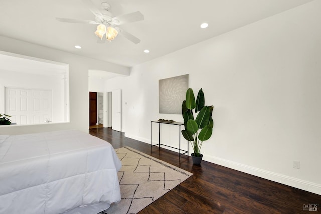 bedroom featuring baseboards, dark wood-type flooring, a ceiling fan, and recessed lighting