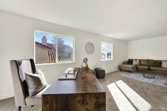 office area with light carpet and baseboards