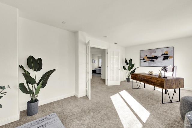 interior space featuring baseboards, light colored carpet, and french doors