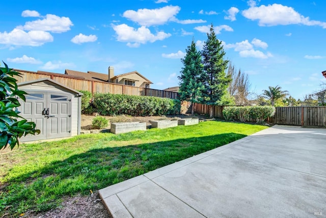 view of yard with a storage unit, a patio area, a fenced backyard, and a garden