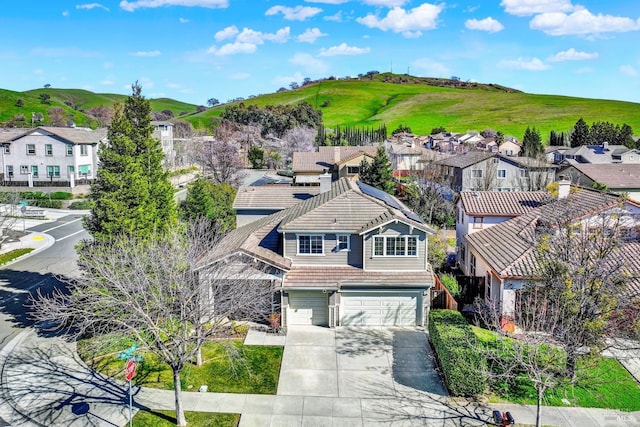 aerial view featuring a mountain view and a residential view