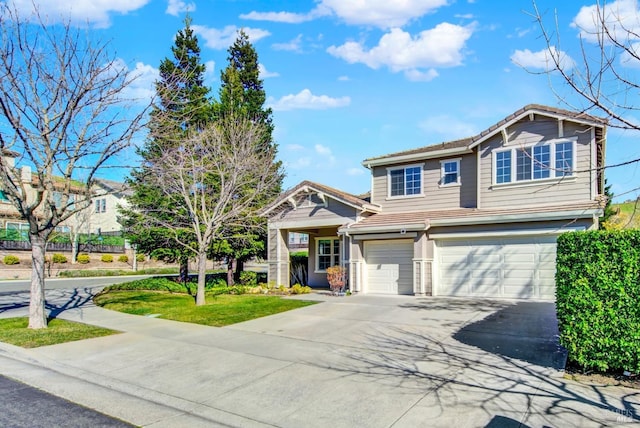 view of front of home featuring driveway, a tile roof, and a garage