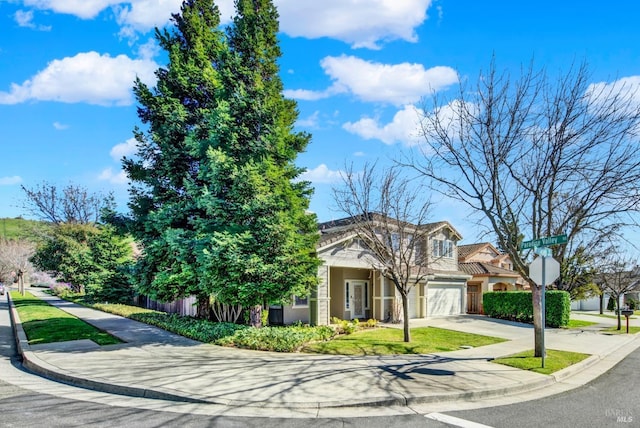 view of front of home with a garage and concrete driveway