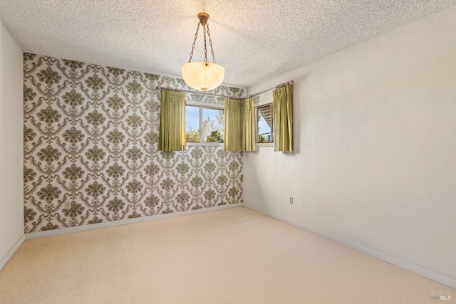 1579 Leslie Ln, Kelseyville, CA 95451 - carpeted spare room featuring a textured ceiling, wallpapered walls, and baseboards