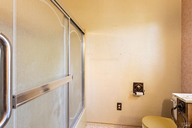 full bathroom with toilet, combined bath / shower with glass door, and vanity