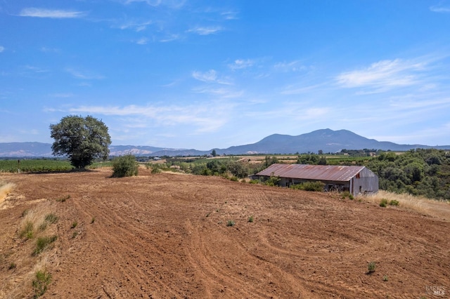 property view of mountains featuring a rural view