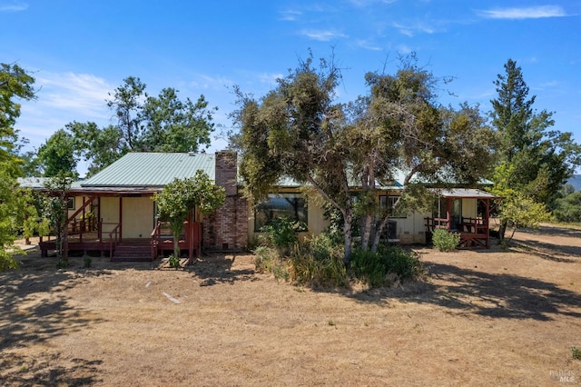 back of property with metal roof