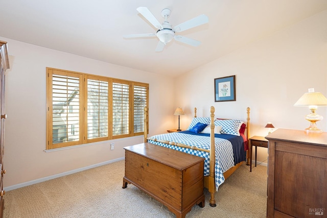 bedroom featuring lofted ceiling, ceiling fan, baseboards, and carpet flooring