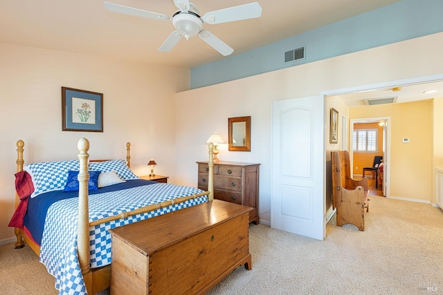 bedroom featuring a ceiling fan, visible vents, light carpet, and baseboards