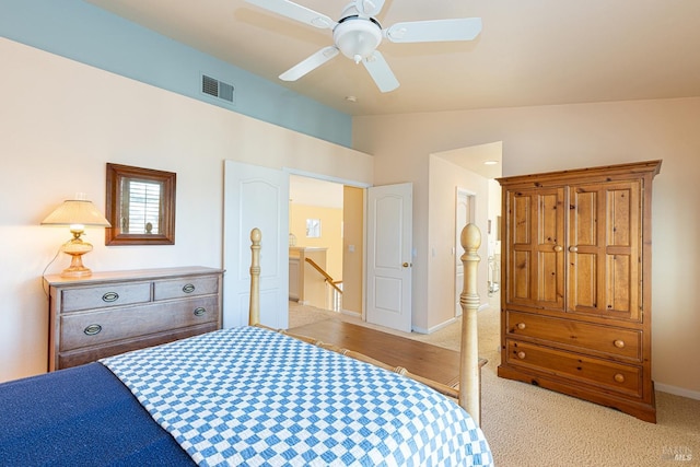 bedroom featuring visible vents, baseboards, ceiling fan, carpet, and vaulted ceiling