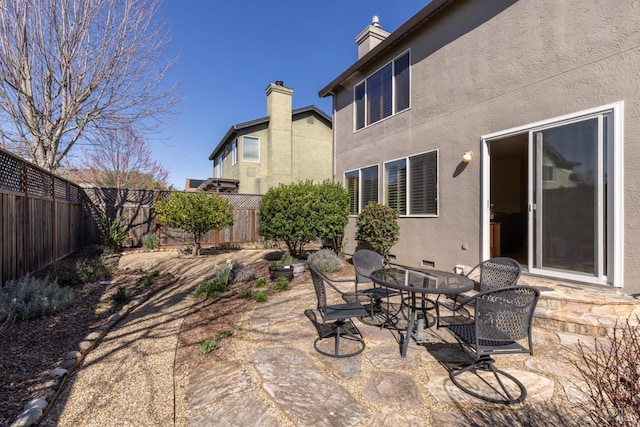 view of patio / terrace featuring outdoor dining space and a fenced backyard