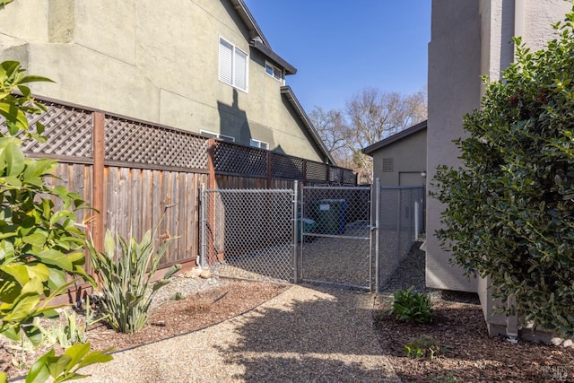 exterior space featuring fence and a gate