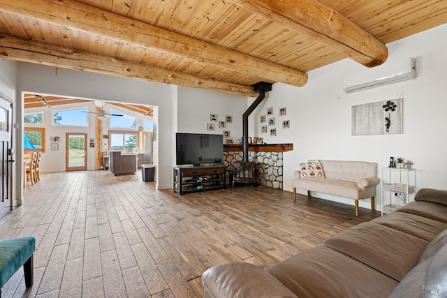 living room with a wall unit AC, wood finished floors, wood ceiling, beamed ceiling, and a wood stove