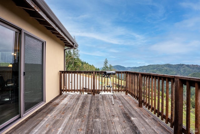 wooden terrace with a mountain view