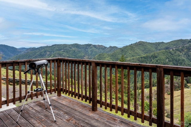 wooden terrace with a mountain view