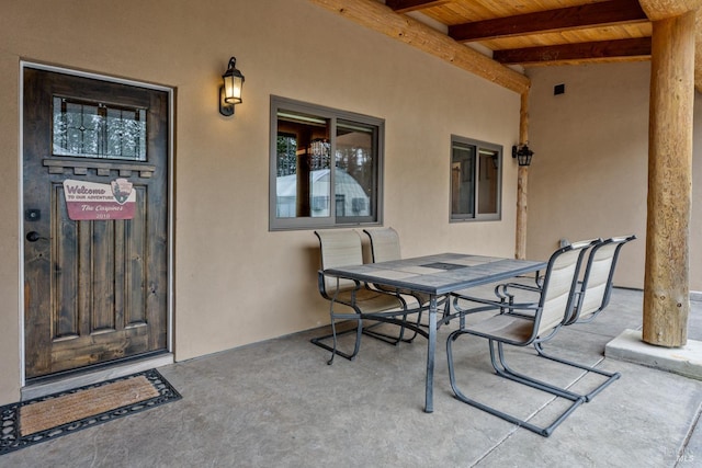 view of patio featuring outdoor dining area