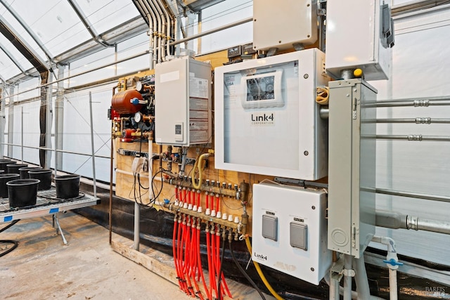 utility room featuring tankless water heater