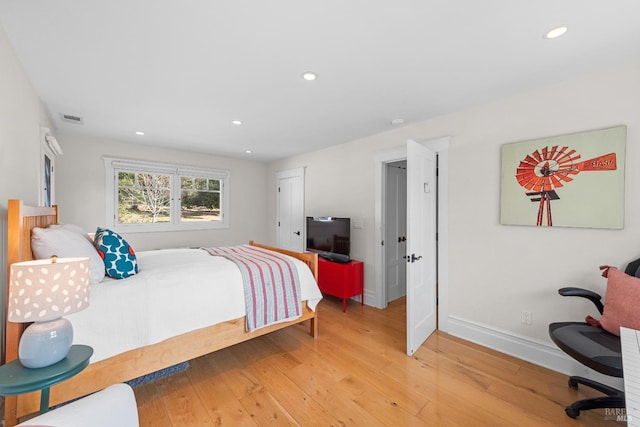 bedroom with recessed lighting, visible vents, and light wood-style floors