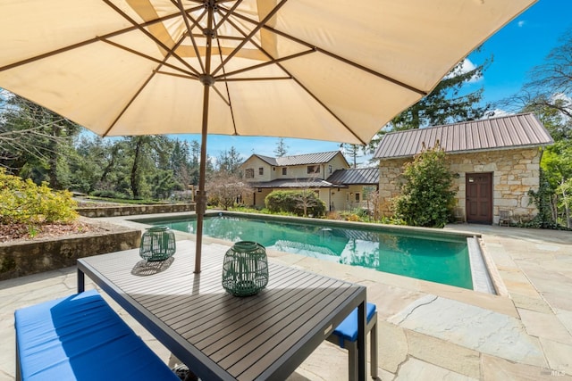 pool with a patio area