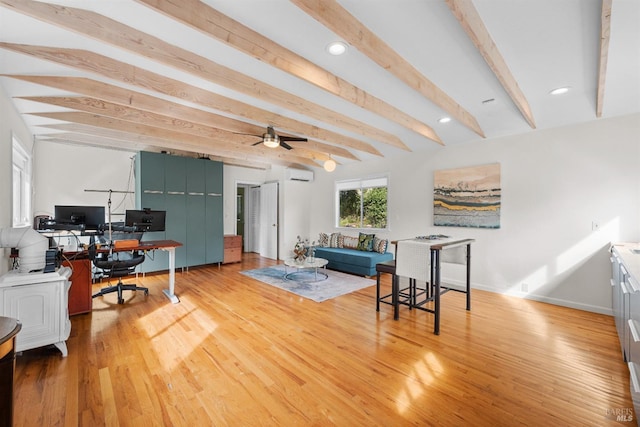 home office featuring light wood-style flooring, a wall mounted AC, beam ceiling, and baseboards