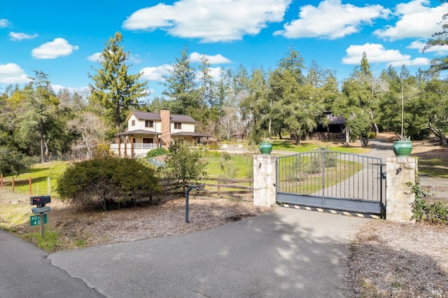 view of gate with fence