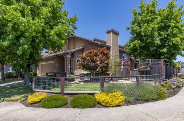 view of front of house featuring a fenced front yard and a chimney