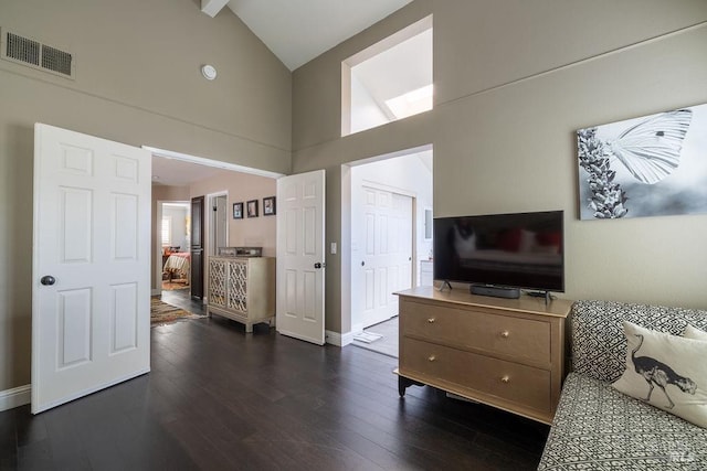 bedroom featuring dark wood-style floors, high vaulted ceiling, visible vents, and baseboards