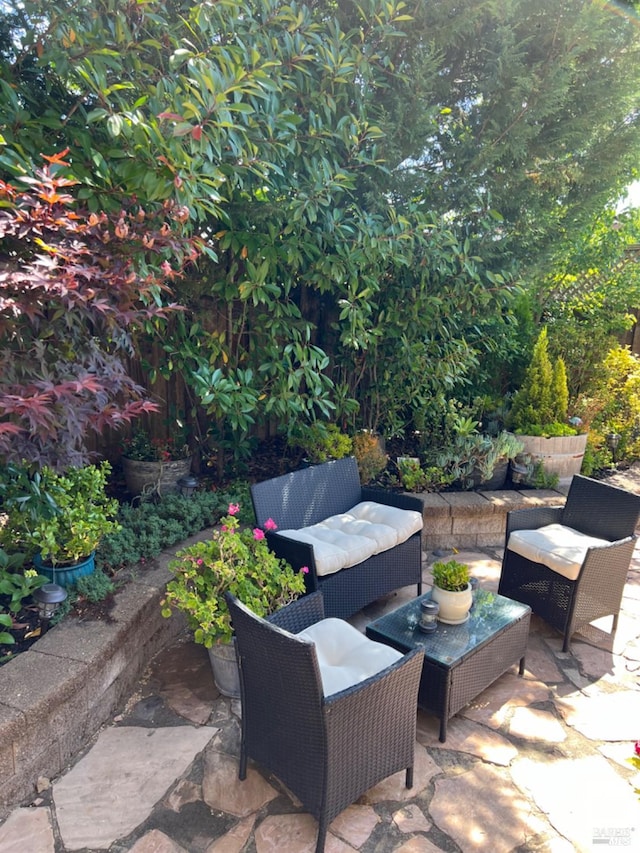 view of patio / terrace featuring fence and an outdoor living space