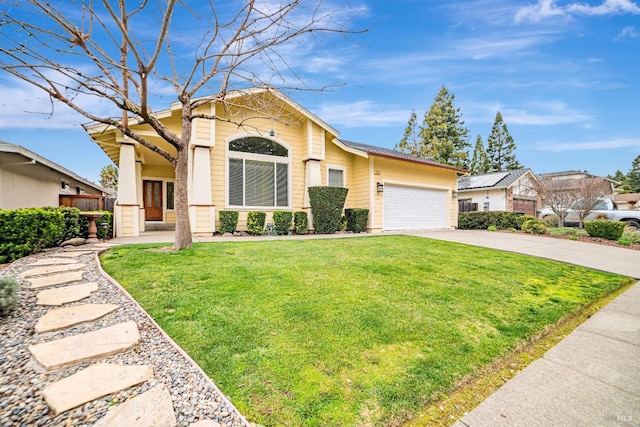 view of front of house with a garage, a front yard, and concrete driveway