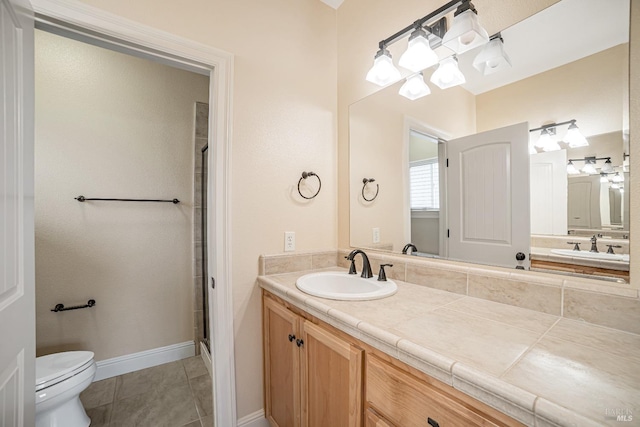 full bathroom with baseboards, toilet, a shower with door, tile patterned floors, and vanity