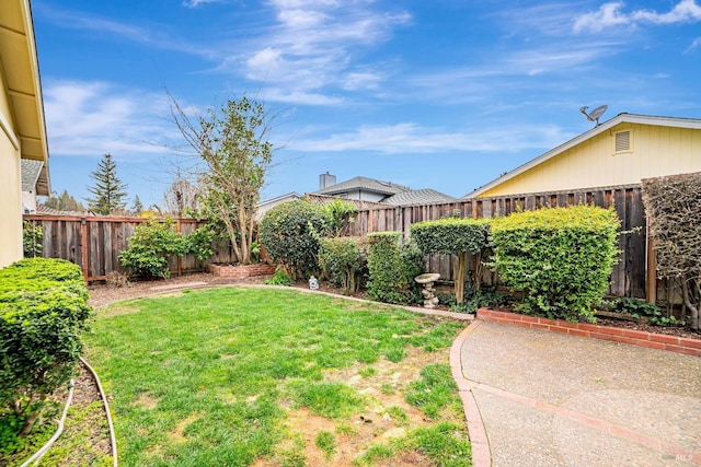 view of yard featuring a fenced backyard